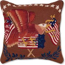 A pillow featuring the bald eagle and flag of the United States of America